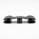 Two black seal offcuts lying flat on white, joined magnet to magnet with a glass channel at each end