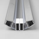 Two chrome-look seal lengths angled together on white, white magnet housings meeting between the channels