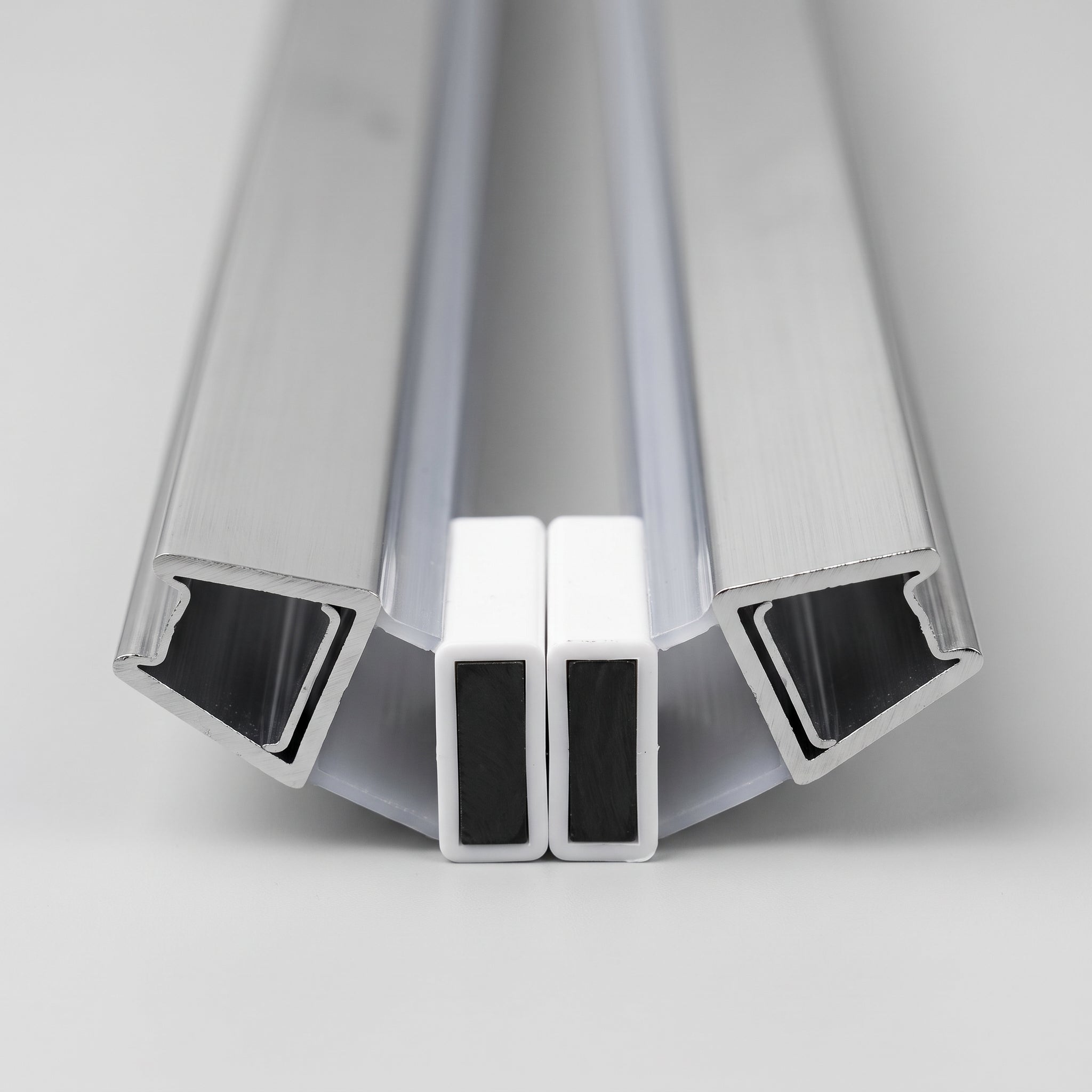 MAG003CP chrome magnetic seal pair profile - 10mm U-channels at 135 degrees with white magnet housings meeting in the middle