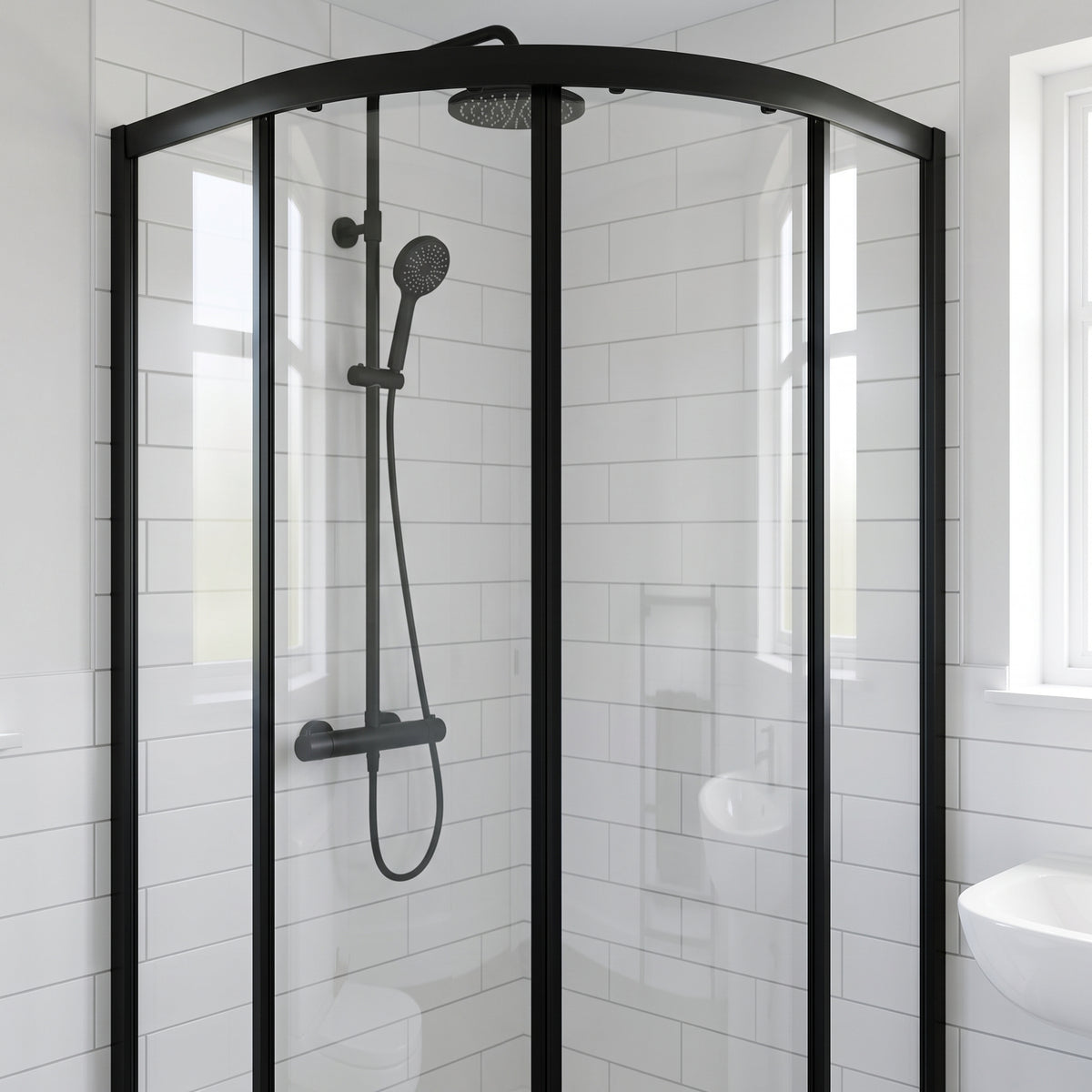 Closed black-framed quadrant enclosure in a white-tiled bathroom, black shower riser and windows behind