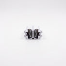 Pair of white magnetic seals snapped together end-on, M-shaped crowns outward and dark magnets meeting inside
