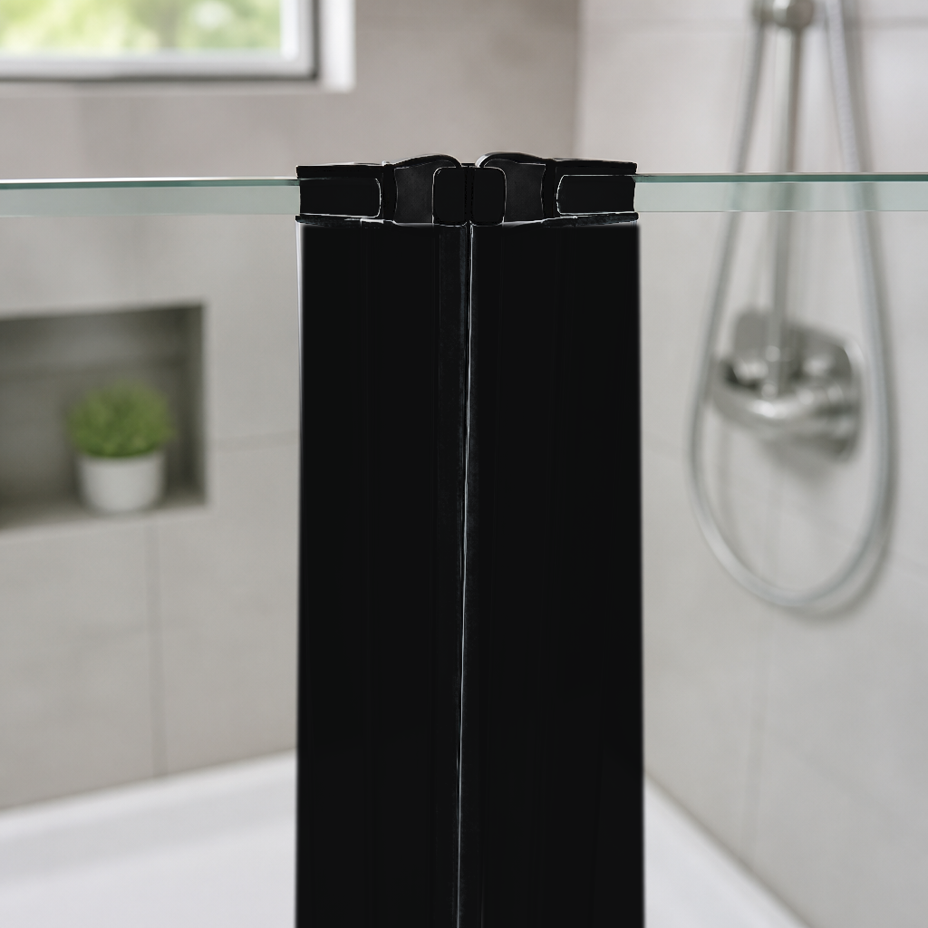 Black inline magnetic seals joining two glass shower panels, chrome valve and hose on grey tiles behind
