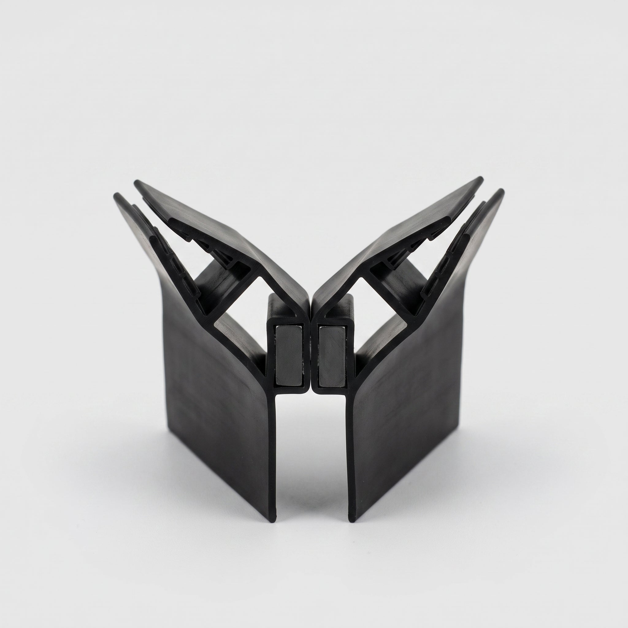 MAG012B black magnetic seal pair profile - 10mm U-channels at 90 degrees with black magnet housings meeting in the middle