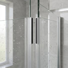 Clear magnetic seals meeting where two glass shower doors close, dark magnet strips seen through wet glass