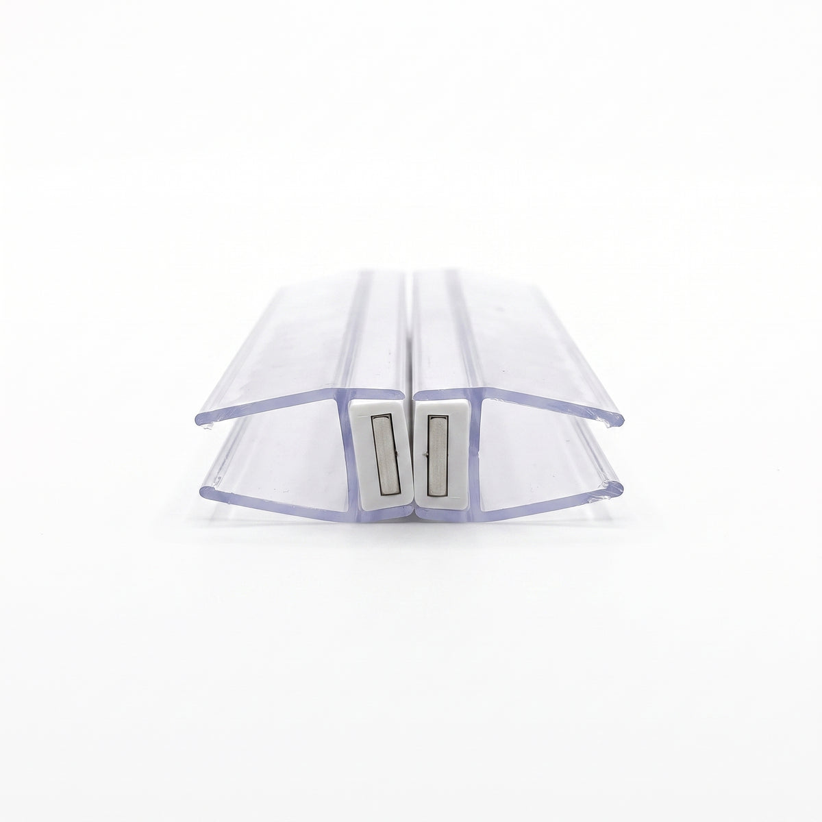 Two clear magnetic seal profiles closed face to face on white, pale magnet blocks meeting at the centre