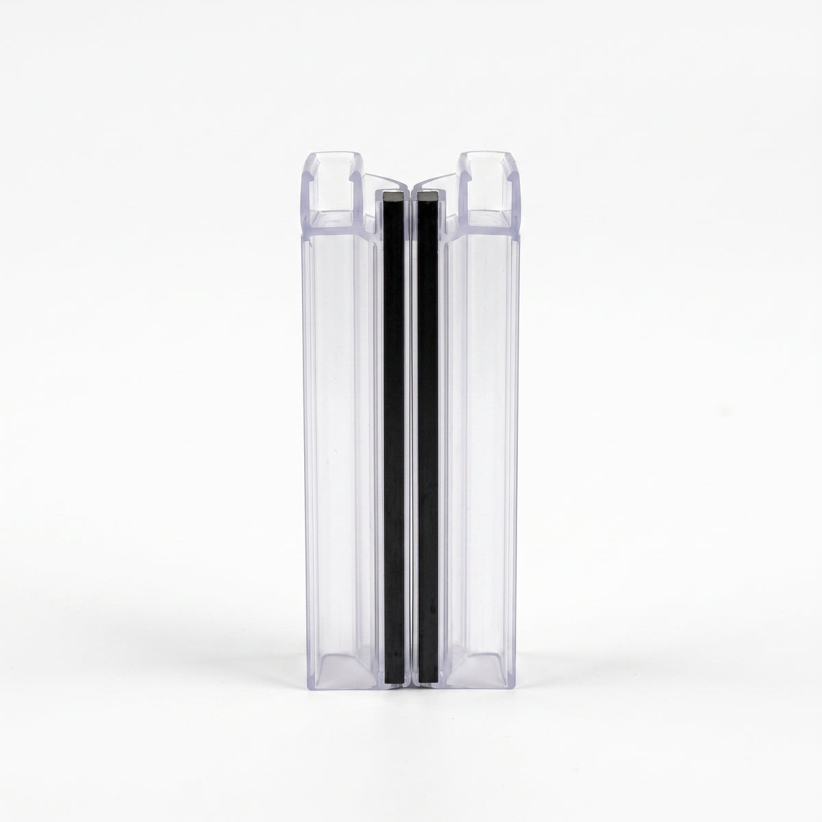 Two clear magnetic seal profiles snapped together on white, black magnet strips meeting inline, end-on view