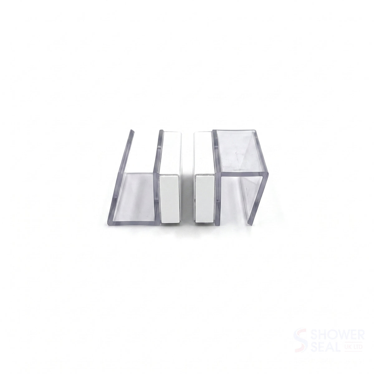 Two clear U-channel seal profiles facing each other on white, white magnet strips at the meeting faces