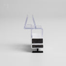Magnetic seal set end-on on white, clear over-glass channel above a white body holding two black magnets