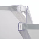 Clear seal profiles gripping two glass panel edges, white magnet blocks meeting where they close