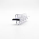 Clear offset magnetic seal profiles engaged on white, a black magnet block clamped between the two arms