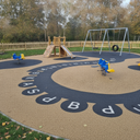 Dark grey playground paint games trail at a UK nursery outdoor play area