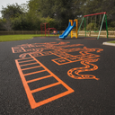 Orange playground paint snakes and ladders games trail at a UK nursery