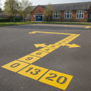 Yellow playground paint number line games trail on a UK school playground