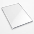 Clear polycarbonate sheet angled on a white background, bevelled edges catching the light