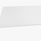 Close view across a prismatic acrylic sheet, rows of small moulded prisms on the face above a square-cut edge