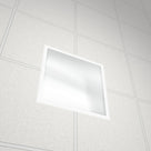 Square prismatic acrylic diffuser glowing in a suspended-ceiling light fitting, seen at an angle from below