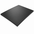 Black RG1000 slab angled on white, lightly grained top face and a thick square-sawn edge