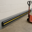 Double D Rubber Wall Guards installed in loading bay - row of three guards protecting loading dock wall