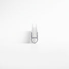 Small clear seal offcut end-on on white, narrow glass channel above a hollow D-shaped bubble