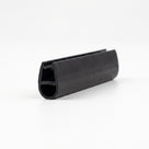 Black seal offcut on white, glass channel above an oval hollow bubble at the cut end