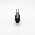 Black seal viewed end-on down its length on white, narrow glass channel above a hollow bulb