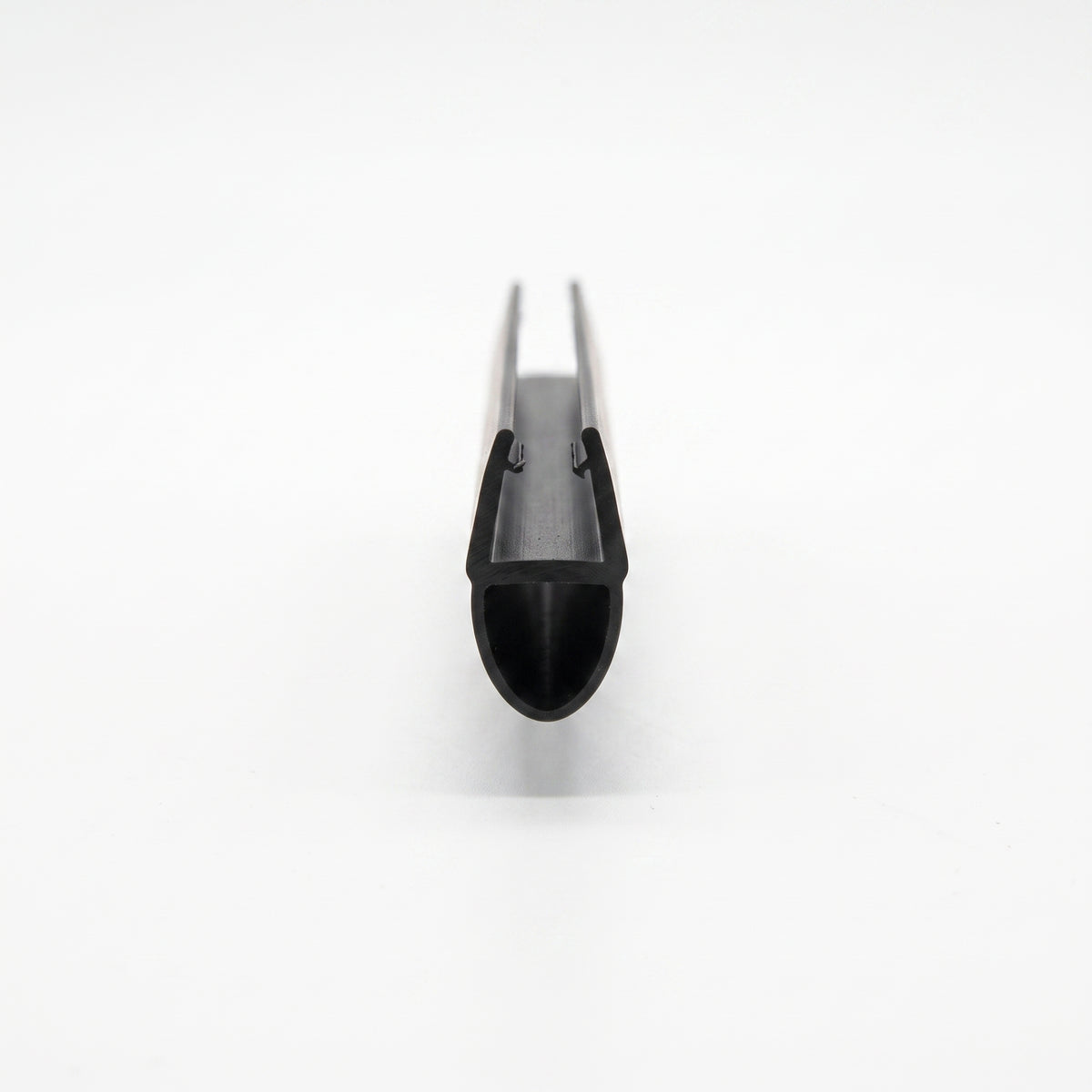 Black seal viewed end-on down its length on white, narrow glass channel above a hollow bulb