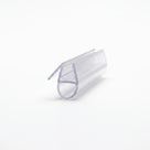 Clear seal offcut angled on white, glass channel with a round hollow bubble and an angled fin