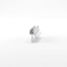 Small seal offcut on white, brushed chrome channel with two clear angled fins below