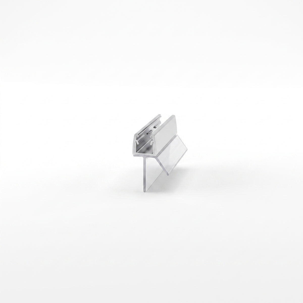 Small seal offcut on white, brushed chrome channel with two clear angled fins below