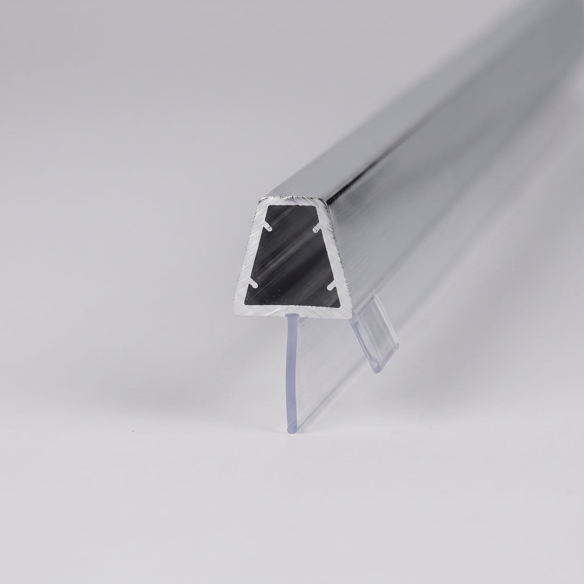 Length of seal on white, polished chrome channel with gripping nibs and clear angled fins below