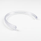 Clear pre-curved seal on white, bent into a near-circle with the blade on the outer face