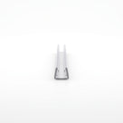 Small clear U-channel offcut end-on on white, plain glass channel with no fin
