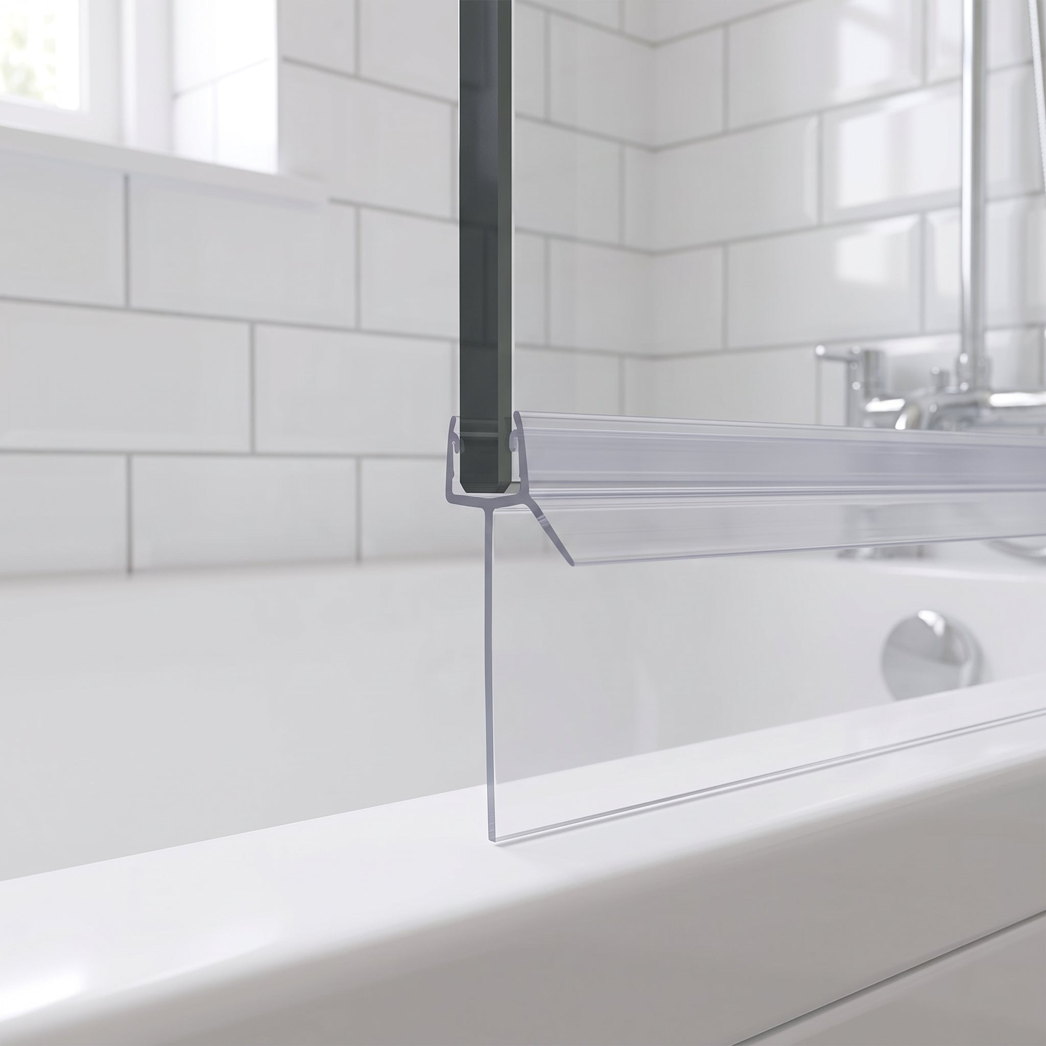 Clear SEAL041 seal on a bath screen bottom edge - 35mm fin closing a large gap to the bath rim