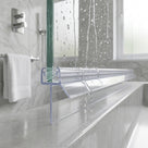 Clear seal with a long drop fin under a wet glass screen on a grey stone shelf, marble tiles behind