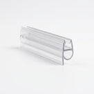 Cut length of clear shower seal on white, angled - glass channel with a round bubble loop on one side