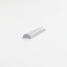 Offcut of clear half-round threshold seal on white, curved top with a flat base at the cut end