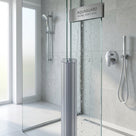 Ribbed clear joint seal full height between two glass panels, labelled Aquaguard Inline Joint Seal
