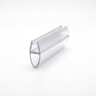 Clear seal offcut angled on white, glass channel with a large teardrop-shaped hollow bubble below