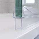Clear seal capping the bottom edge of 6-8mm glass, angled fin and twin 10mm blades closing a 5-10mm gap to the tray