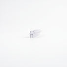 Small cut piece of clear shower seal centred on a white background - channel with a short angled fin