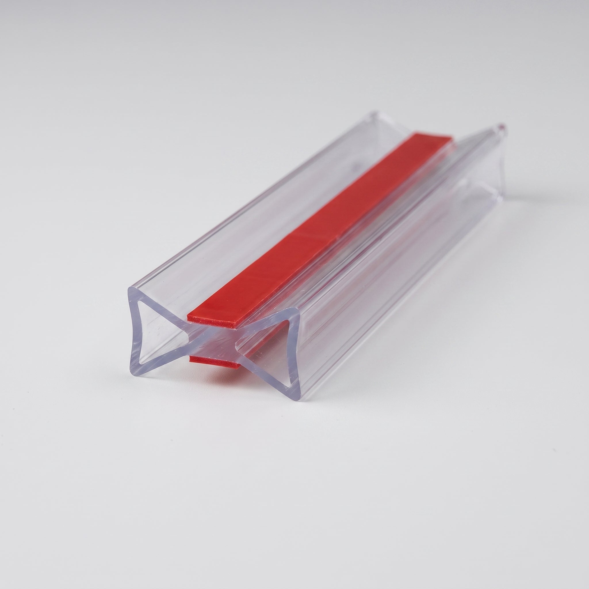 SEAL092 clear I-join profile - 12mm bow-tie section with 4.5mm flared ends, 2mm waist and pre-applied 3M VHB tape with red liners