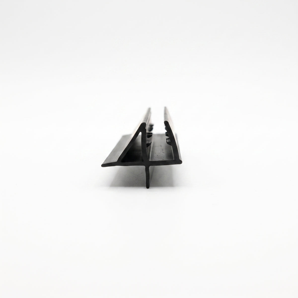Black seal offcut end-on on white, channel with a sloping wing and a short drop fin