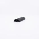 Short offcut of black rubber threshold seal on white, domed top with a hollow arch at the cut end