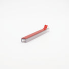 Short cut length of clear carrier channel on white, red VHB tape along the top face with the liner tab lifted