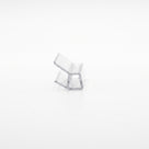Small clear seal offcut on white, end-on - glass channel with two angled blades below