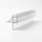 Clear shower seal offcut on white, glass channel with a curved flick fin and a straight blade below