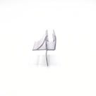 Clear seal offcut end-on on white, curved deflector fin one side and a long straight fin below