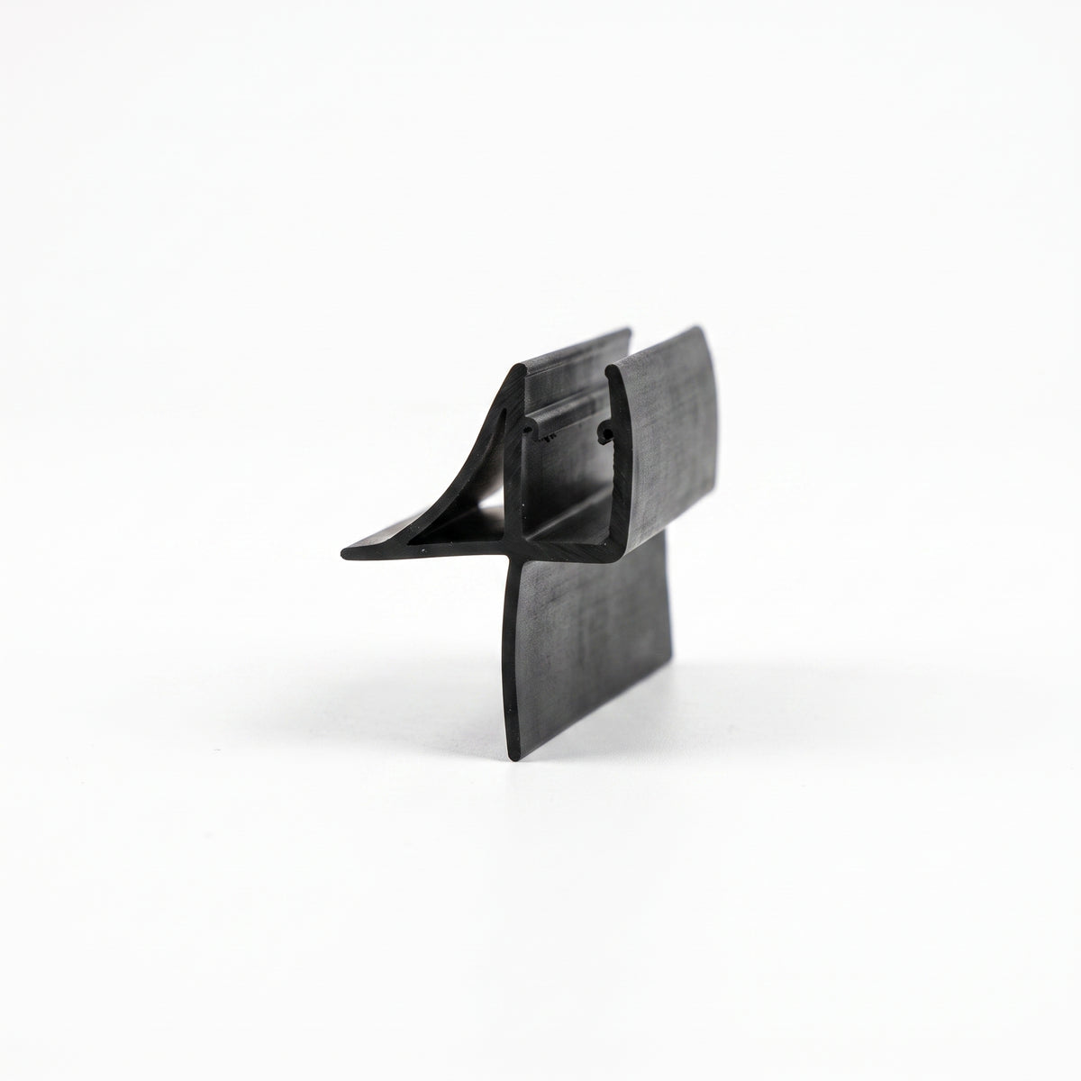 Black seal offcut on white, channel with a sweeping upper wing and a long curved lower fin