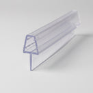 Clear PVC tapered seal profile angled on white, ribbed channel above a wide soft fin, cut end to camera