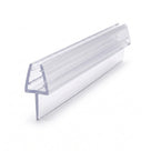Clear PVC tapered seal profile on white, ribbed channel above a broad fin, cut end angled to camera